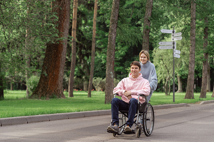 woman and man in a wheel chair